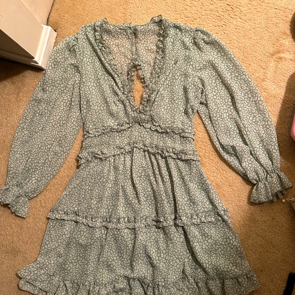 Green ruffled v neck dress with open back